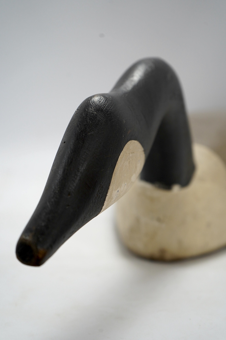 A vintage carved and painted wood decoy goose, 80cm in length. Condition - fair
